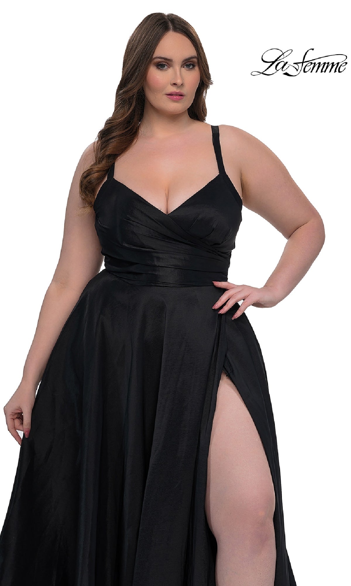 A woman models the Long Plus-Size Prom Dress La Femme 33075—a black sleeveless gown with a faux-wrap v-neck and high slit—against a white background featuring the